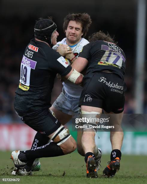 Marcelo Bosch of Saracens is tackled by Mitch Lees and Alec Hepburn during the Aviva Premiership match between Exeter Chiefs and Saracens at Sandy...