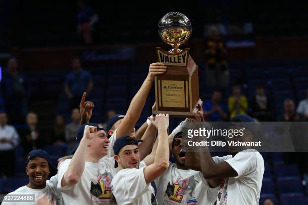 Members of the Loyola Ramblers hold the Missouri Valley Conference Champions trophy after beating the Illinois State Redbirds during the Missouri...