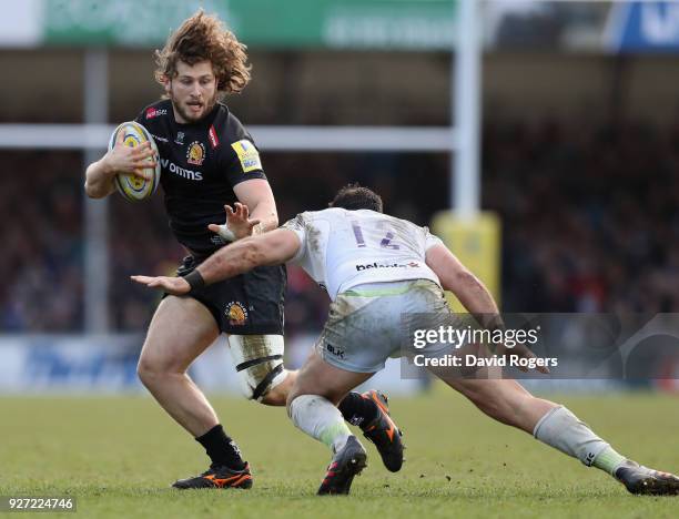 Alec Hepburn of Exeter Chiefs takes on Brad Barritt during the Aviva Premiership match between Exeter Chiefs and Saracens at Sandy Park on March 4,...