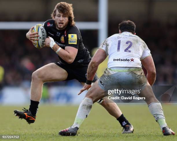 Alec Hepburn of Exeter Chiefs takes on Brad Barritt during the Aviva Premiership match between Exeter Chiefs and Saracens at Sandy Park on March 4,...
