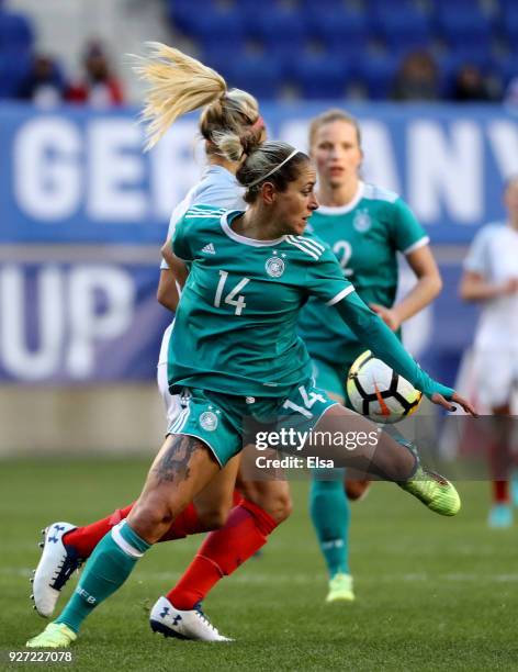 Anna Blässe of Germany and Rachel Daly of England fight for the ball in the second half during the SheBelieves Cup at Red Bull Arena on March 4, 2018...