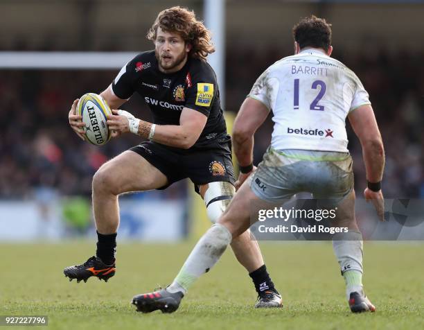 Alec Hepburn of Exeter Chiefs takes on Brad Barritt during the Aviva Premiership match between Exeter Chiefs and Saracens at Sandy Park on March 4,...