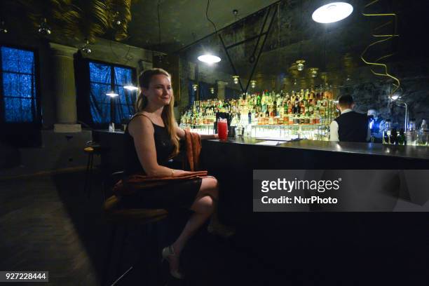 Lady with a drink between two Argentine tango dances during a photocall of the Krakus Aires Tango Festival, a 'festival-bridge' between eastern and...