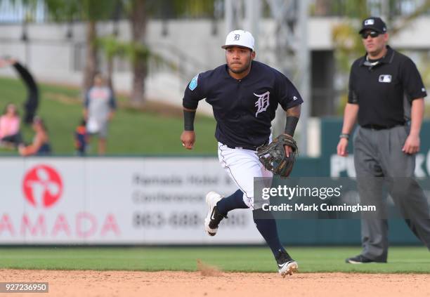 Alexi Amarista of the Detroit Tigers fields during the Spring Training game against the Atlanta Braves at Publix Field at Joker Marchant Stadium on...