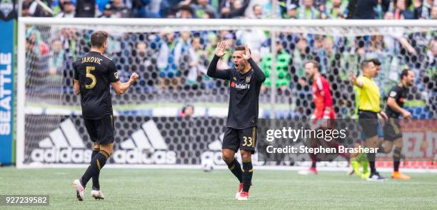 Dejan Jakovic of Los Angeles FC and Benny Feilhaber of Los Angeles FC celebrate a goal by Diego Rossi of Los Angeles FC during the first half of...