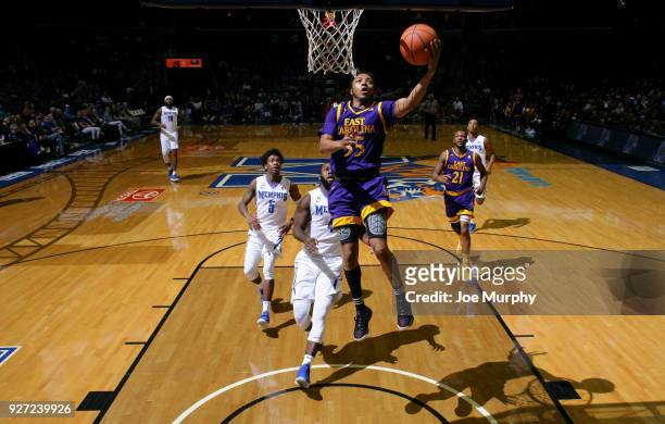 Shawn Williams of the East Carolina Pirates drives to the basket for a layup against the Memphis Tigers on March 4, 2018 at FedExForum in Memphis,...