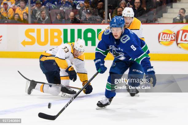 Brendan Leipsic of the Vancouver Canucks skates with the puck ahead of Viktor Arvidsson and Calle Jarnkrok of the Nashville Predators during their...