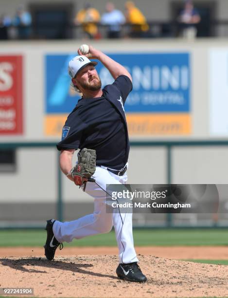 Travis Wood of the Detroit Tigers pitches during the Spring Training game against the Atlanta Braves at Publix Field at Joker Marchant Stadium on...