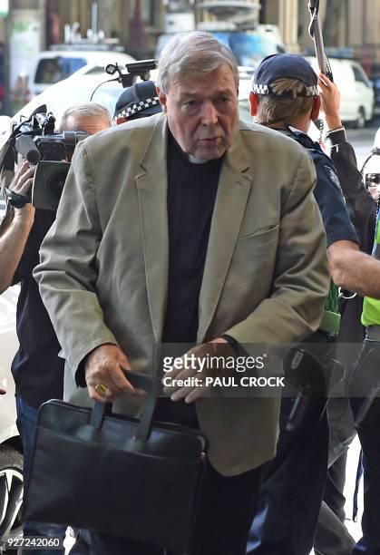 Cardinal George Pell arrives at the Victorian Magistrates Court for an expected month-long committal hearing relating to historical sexual offence...