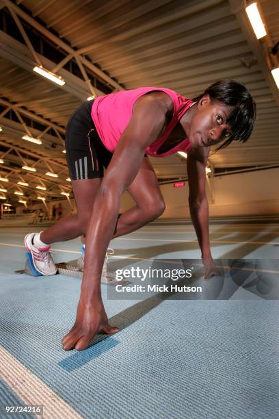 English runner Christine Ohuruogu poses on starting blocks for a portrait session at Lea Valley Athletics Centre on December 16th, 2008 in London.