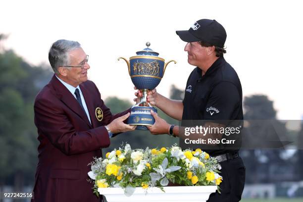 Phil Mickelson receives the the Gene Sarazen Cup after winning the World Golf Championships-Mexico Championship on a playoff hole at Club De Golf...