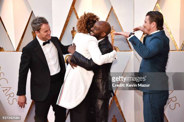 Jason Clarke, director Dee Rees, Rob Morgan and Garrett Hedlund attend the 90th Annual Academy Awards at Hollywood & Highland Center on March 4, 2018...