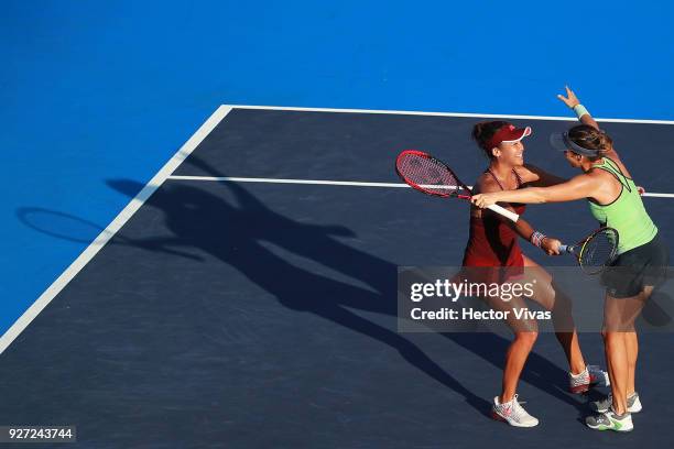 Tatjana Maria of Germany and Heather Watson of Great Britain celebrate during the doubles Championship match between Tatjana Maria of Germany with...