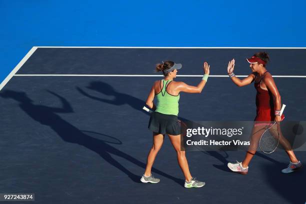 Tatjana Maria of Germany and Heather Watson of Great Britain celebrate during the doubles Championship match between Tatjana Maria of Germany with...