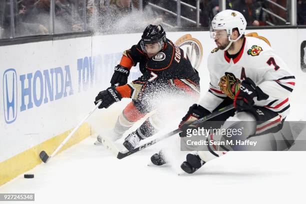 Andrew Cogliano of the Anaheim Ducks battles Brent Seabrook of the Chicago Blackhawks for a loose puck during the third period of a game at Honda...