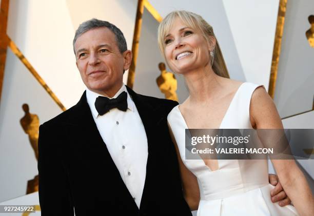 Bob Iger and Willow Bay arrive for the 90th Annual Academy Awards on March 4 in Hollywood, California. / AFP PHOTO / VALERIE MACON