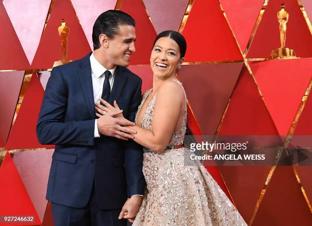 Actress Gina Rodriguez and her partner Joe Locicero arrive for the 90th Annual Academy Awards on March 4 in Hollywood, California. / AFP PHOTO /...