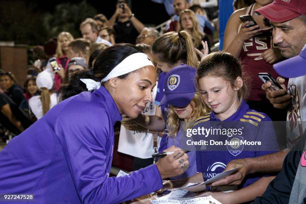 Sydney Leroux of the Orlando Pride signs some items for fans after a pre-season match against the Florida State Seminoles at the Seminole Soccer...