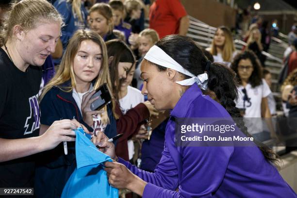 Sydney Leroux of the Orlando Pride signs some items for fans after a pre-season match against the Florida State Seminoles at the Seminole Soccer...