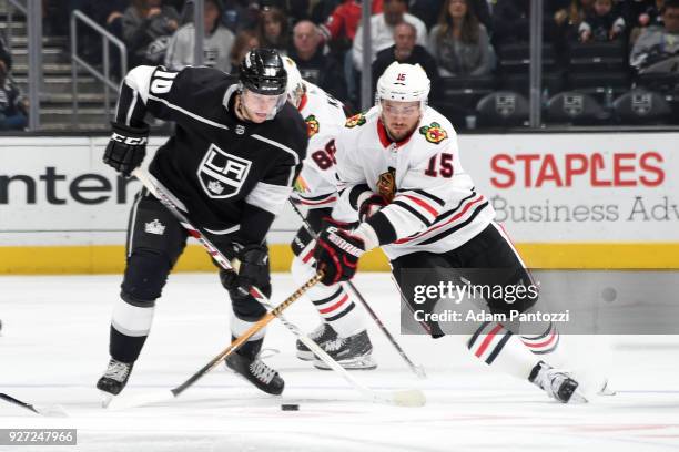 Artem Anisimov of the Chicago Blackhawks battles for the puck against Tobias Rieder of the Los Angeles Kings at STAPLES Center on March 3, 2018 in...