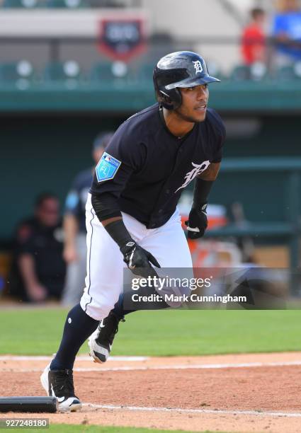 Alexi Amarista of the Detroit Tigers bats during the Spring Training game against the Atlanta Braves at Publix Field at Joker Marchant Stadium on...