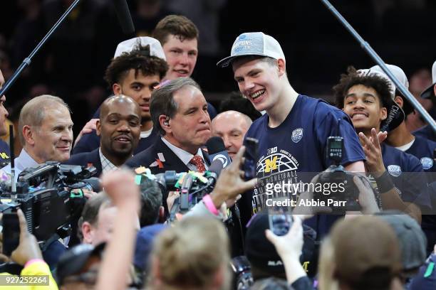 Moritz Wagner of the Michigan Wolverines celebrates after being named tournament MVP after defeating the Purdue Boilermakers 75-66 during the...