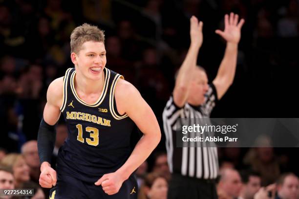 Tournament MVP Moritz Wagner of the Michigan Wolverines reacts after making a three point basket in the second half against the Purdue Boilermakers...