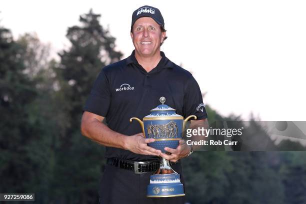 Phil Mickelson poses with the Gene Sarazen Cup after winning the World Golf Championships-Mexico Championship on a playoff hole at Club De Golf...