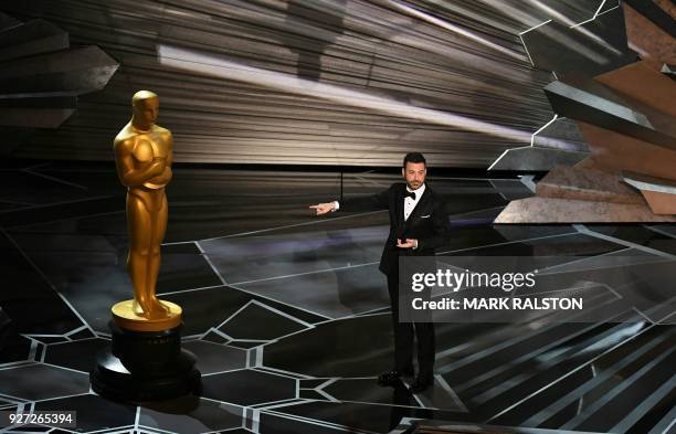 Comedian Jimmy Kimmel delivers a speech during the opening of the 90th Annual Academy Awards show on March 4, 2018 in Hollywood, California.