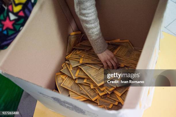 Paper ballots are counted after the end of voting in the Italian general elections on March 4, 2018 in Naples, Italy. The economy and immigration are...