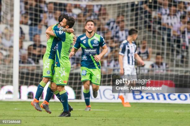 Omar Fernandez of Puebla celebrates with teammates after scoring his team's first goal during the 10th round match between Monterrey and Puebla as...