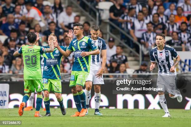 Omar Fernandez of Puebla celebrates with teammates after scoring his team's first goal during the 10th round match between Monterrey and Puebla as...