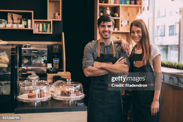 baristas at the coffee shop - avental imagens e fotografias de stock
