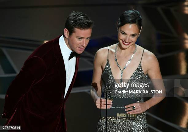 Actor Armie Hammer and Israeli actress Gal Gadot present the Oscar for Best Makeup and Hairstyling during the 90th Annual Academy Awards show on...