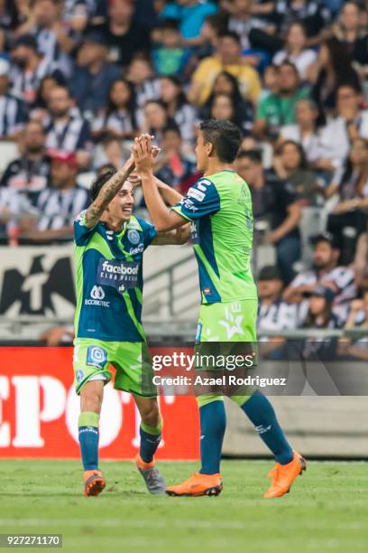 Luis Gerardo Venegas of Puebla celebrates with teammates after scoring his team's second goal during the 10th round match between Monterrey and...