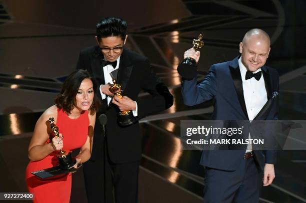Make-Up and Hairstyling artists Lucy Sibbick, Kazuhiro Tsuji and David Malinowski accept the Oscar for Best Makeup and Hairstyling in Darkest Hour...