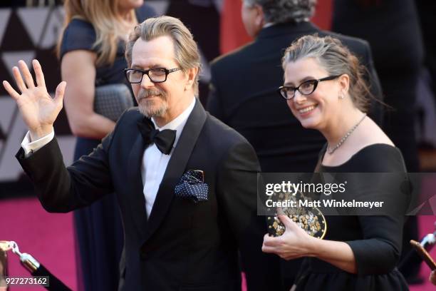 Gary Oldman and Gisele Schmidt attends the 90th Annual Academy Awards at Hollywood & Highland Center on March 4, 2018 in Hollywood, California.