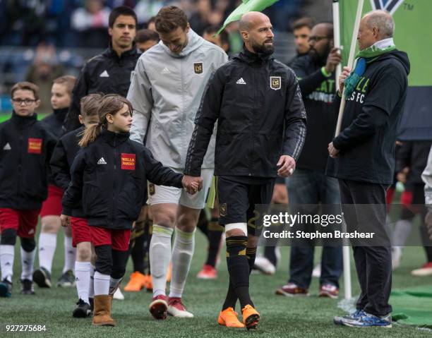 Members Los Angeles FC including Laurent Ciman, second from left, of Los Angeles FC, and Tyler Miller, third from left, #1 of Los Angeles FC walk on...