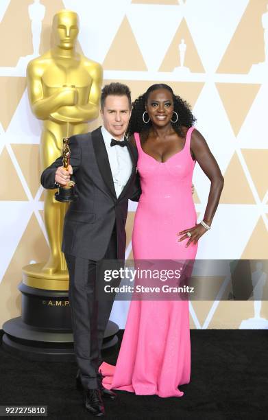 Actor Sam Rockwell , winner of the Best Supporting Actor award for 'Three Billboards Outside Ebbing, Missouri,' and actor Viola Davis, wearing...