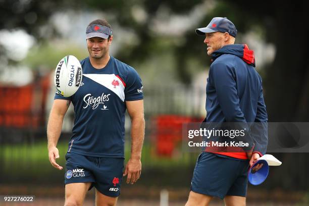 Boyd Cordner speaks to Craig Fitzgibbon during a Sydney Roosters NRL training session at Kippax Lake on March 5, 2018 in Sydney, Australia.