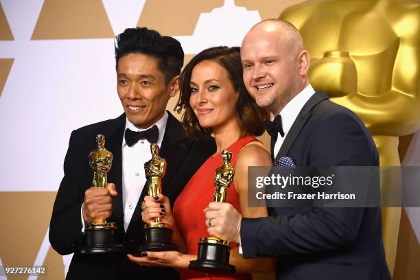 Make-up artists Kazuhiro Tsuji, Lucy Sibbick, and David Malinowski, winners of the Best Makeup and Hairstyling award for 'Darkest Hour,' pose in the...