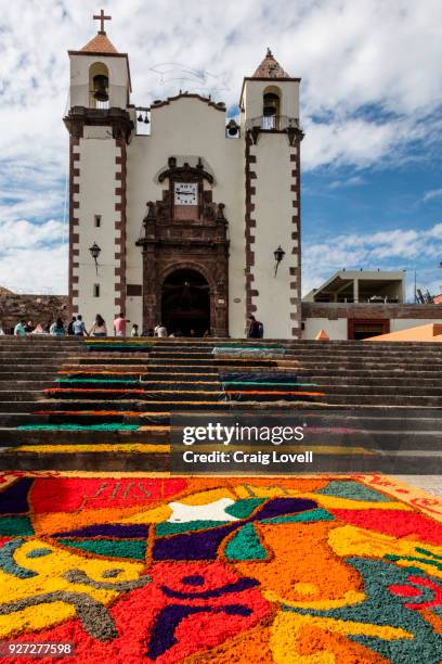 alfombras or religious temporary carpets is set up at the san antonio church during christmas - san miguel de allende, mexico - alfombra stock pictures, royalty-free photos & images