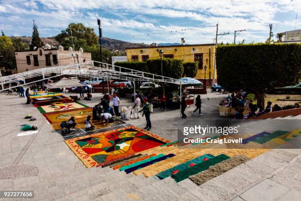 alfombras or religious temporary carpets is set up at the san antonio church during christmas - san miguel de allende, mexico - alfombra stock pictures, royalty-free photos & images