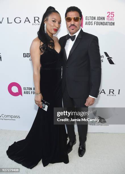 Lisa Parigi and Lionel Richie attend the 26th annual Elton John AIDS Foundation Academy Awards Viewing Party sponsored by Bulgari, celebrating EJAF...