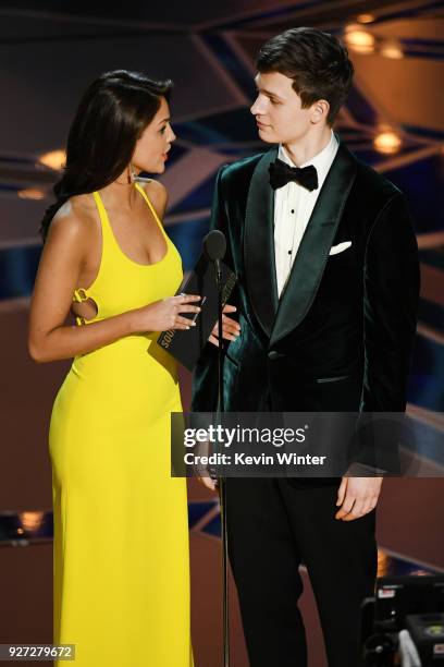 Actors Eiza Gonzalez and Ansel Elgort speak onstage during the 90th Annual Academy Awards at the Dolby Theatre at Hollywood & Highland Center on...