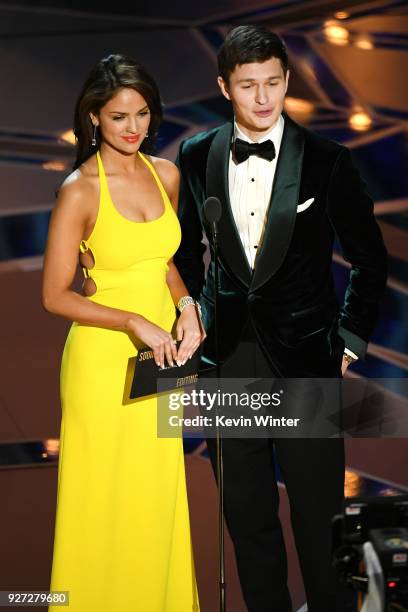 Actors Eiza Gonzalez and Ansel Elgort speak onstage during the 90th Annual Academy Awards at the Dolby Theatre at Hollywood & Highland Center on...