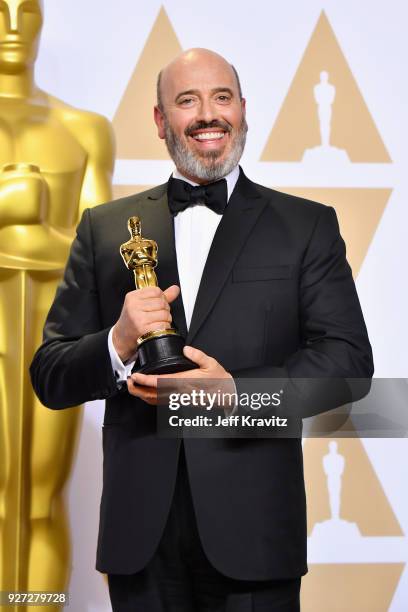 Mark Bridges winner of the Best Costume Design for Phantom Thread poses in the press room during the 90th Annual Academy Awards at Hollywood &...