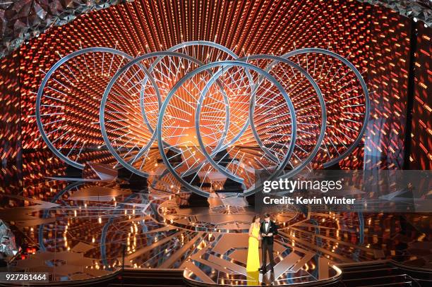 Actors Eiza Gonzalez and Ansel Elgort speak onstage during the 90th Annual Academy Awards at the Dolby Theatre at Hollywood & Highland Center on...