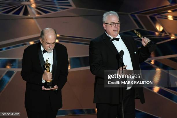 Sound editors Alex Gibson and Richard King deliver a speech after they won the Oscar for Best Sound Editing "Dunkirk" during the 90th Annual Academy...