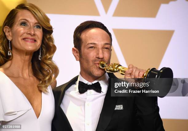 Actor Laura Dern and director Bryan Fogel, winner of the Best Documentary Feature award for 'Icarus,' pose in the press room during the 90th Annual...